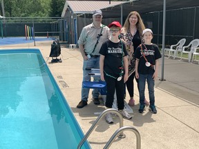 The Bill family is known at Campfire Circle as the 'Fundraising Warriors', especially after raising funds for a chair lift for the camp swimming pool, seen here with Ian Bill, left, Ethan Bill, who has a non-malignant brain tumour, Stacey Bourbonnais, and Edward Bill.