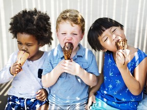 Children enjoying ice cream cones.