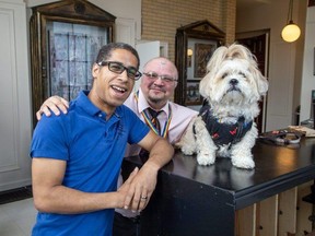 London Pride secretary Stephen D’Amelio, left, is with James O’Deary and Corben, the Pride puppy at Aeolian Hall on Tuesday, July 18, 2023 ahead of Tuesday night’s event called Transformative, at which O’Deary is the keynote speaker. Transformative is an “event for transgender men and women to navigate through their lives in London.” (Derek Ruttan/London Free Press)