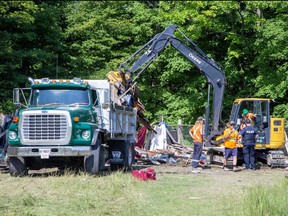A homeless encampment adjacent to Victor Drive was dismantled in St. Thomas on Wednesday July 19, 2023. Derek Ruttan/The London Free Press