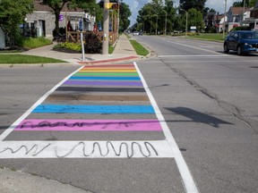 A Pride crosswalk at the intersection of Broadway and Bridge Street has been vandalized in Tillsonburg. Photo shot on Monday July 31, 2023. (Derek Ruttan/London Free Press)