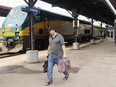 A traveller is shown at the VIA station on York Street in downtown London on Sunday July 9, 2023. (Mike Hensen/The London Free Press)