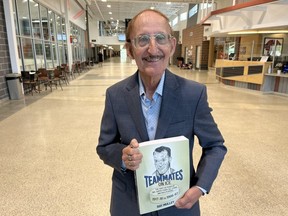 Author Ray Mulley at Cornwall Benson Centre holding his book Teammates on Ice