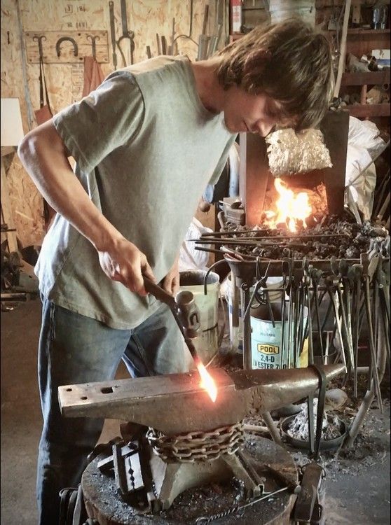 Young artisan in a foundry