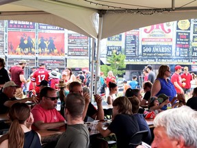 Tables were packed as people came out to enjoy the 1,000 Islands Family Ribfest in Gananoque from June 30 Ð July 2. Lorraine Payette/for Postmedia Network
