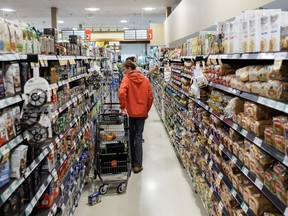 People shop inside a Metro grocery store in Toronto, Tuesday, July 18, 2023.