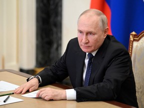 Russian President Vladimir Putin attends a meeting on the Crimean Bridge attack