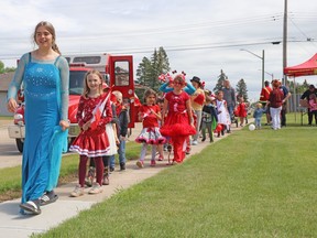 Brooklynne Messerschmidt, dressed as Elsa from Frozen, led a kids' Canada Day parade during the community's July 1 celebration on the Crockett House Café lawn Saturday afternoon.
