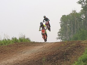 Racing in the 85CC A class, Matthew McClelland and Jayden Moore flew over the Whitecourt Motocross Association's track at WhiteRidge MX Park.