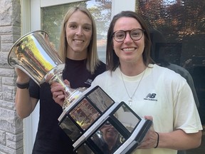 Shiann Darkangelo, left, captain of the Toronto Six, and teammate Elaine Chuli of Waterford, with the Isobel Cup. Chuli brought the Premier Hockey Federation trophy home to Waterford to share it with family and friends on Friday.