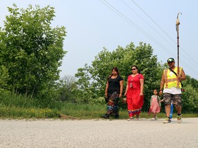 Jessica Martin, Selina Keeshig and Benji Keeshig walk with children Daniela and Stevie during the Saugeen Ojibway Nation water walk near Colpoy's Bay on Sunday, July 16, 2023. Greg Cowan/The Sun Times