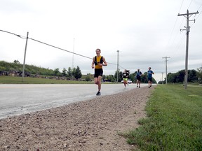 Jesse Walker sets out on the 10-kilometre run to complete his 2023 triathlon in support of childhood cancer research on Saturday, July 29, 2023. Greg Cowan/The Sun Times