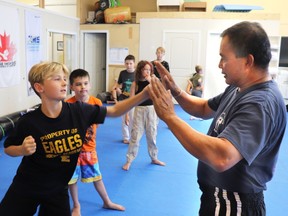 Rylan took some tips on Muay Thai form from instructor Annop Kharuhanan.