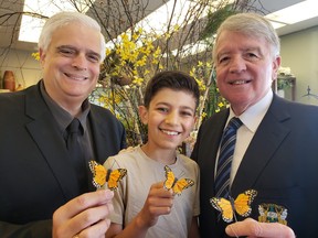 Geoffrey (left) and Gerry Lougheed, with Gerry’s grandson Kiran, get ready for the Maison McCulloch Hospice butterfly release on Aug. 20.