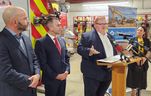 Minister of Natural Resources and Forestry Graydon Smith speaks at the Wheatley fire hall Wednesday, when he announced $11 million in new money for the community as it recovers for the 2021 gas explosion. Also shown are Coun. Aaron Hall, left, Chatham-Kent-Leamington MPP Trevor Jones and Coun. Lauren Anderson. (Trevor Terfloth/The Daily News)
