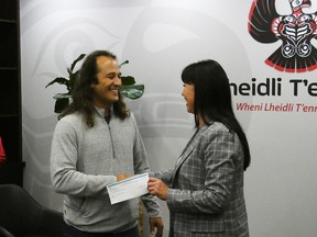 MSS president James Hiebert (left) presented LTFN Chief Dolleen Logan (right) with a cheque for $15,000 to mark the occasion, the first payment from the partnership.