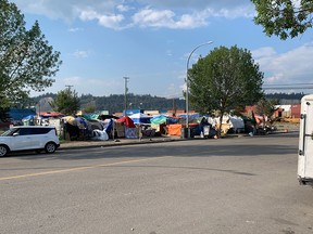 A sprawling tent encampment across a street