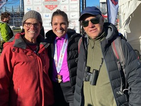 Julie-Anne Staehli poses with her parents, Cathy and Mathew Staehli, at the 2022 Canadian XC Championships in Ottawa.