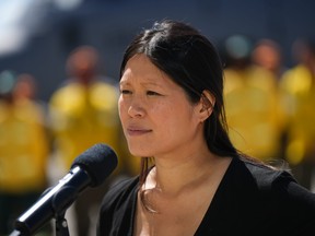 Emergency Management Minister Bowinn Ma pauses while responding to questions at Abbotsford International Airport, in Abbotsford, B.C., on Sunday, July 23, 2023.