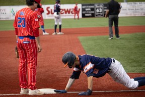 Jayden Conway of Team Fort McMurray makes sure he's safe during a game against Nova Scotia at the 2023 18U National Baseball Championships at Shell Place on Saturday, August 19, 2023. Vincent McDermott/Fort McMurray Today/Postmedia Network
