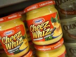 Jars of Cheez Whiz are displayed for sale at a supermarket.