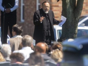 Rev. Henry Hildebrandt preaches to a crowd of roughly 500 during an outdoor service at the Church of God in Aylmer on Sunday May 30, 2021. (Mike Hensen/The London Free Press)