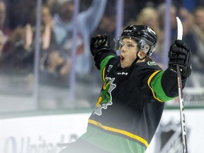 Easton Cowan of the London Knights celebrates his goal in front of the Guelph bench after tying the Nov. 29, 2022 game at Budweiser Gardens 2-2 with only three seconds left in the first period. (Mike Hensen/The London Free Press)