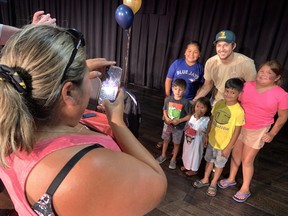 Claudia House, left, took photos of her children and nephews with NHL player Brandon Montour, who was honored by his home community of Six Nations on Thursday.  House said she attended all the watch parties hosted in Ohsweken as the community watched Montour play in the Stanley Cup finals.