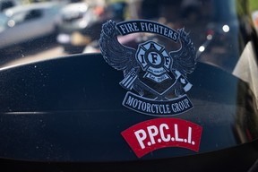 Stickers for the IAFF’s firefighters’ motorcycle group and the Princess Patricia’s Canadian Light Infantry on a motorcycle at the Acden Show and Shine in Fort McMurray on August 13, 2023. Vincent McDermott/Fort McMurray Today/Postmedia Network