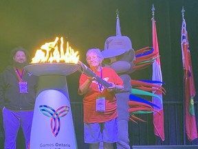 Doris Henhawk, 84, of Six Nations lights the cauldron to officially start the Ontario 55+ Summer Games in Brantford and Brant County during a Wednesday ceremony at the Wayne Gretzky Sports Center in Brantford.  VINCENT BALL/BRANTFORD EXPOSITOR