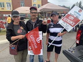 Judy Snetsinger (left), John Murnaghan and Krystal Barr, were among the workers walking a picket line in front of the Metro grocery store on St. Paul Avenue in Brantford on Tuesday, Aug. 15. The workers, represented by Unifor local 414, chanted "One day longer, one day stronger" as the strike entered its third week.