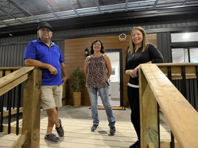Robert "Dude" Bomberry, left, Kali Hill and Spring Sault are leading the Six Nations of the Grand River Development Corporation's tiny homes pilot project, which will gauge community interest in the prefabricated homes as part of the solution to the chronic shortage of affordable housing on the reserve.