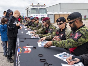 CF Skyhawks team members autograph photos