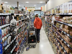 People shop inside a Metro grocery store