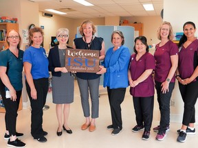 In 2013, Elke Hilgendag (centre, holding sign) and Dr. Catherine Ballyk (third from left) of the Brant Community Healthcare System were part of a team who collaborated to support the opening of an Integrated Stroke Unit. Submitted