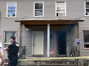 Kingston Police on the scene of a residential house fire at 275 Rideau St., in Kingston, on Tuesday.