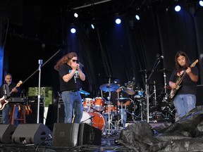 Blues at 11, including (l-r) Mike Nistor, Sheldon Huard, Chris Kennedy and Lee Arcand, performed in the rain at Whitecourt's Party in the Park in June 2023. The band formed in 2021 and is from the region; Arcand is from Whitecourt and Huard has lived in town.
