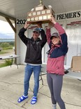 Winner of fishing derby raise the trophy