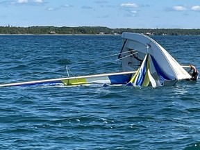 Grey Bruce OPP and the Canadian Coast Guard rescued occupants from this capsized sailboat Saturday, July 29, 2023 in Lake Huron. All were wearing life-jackets. There were no injuries reported. (OPP-supplied photo)