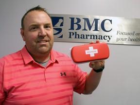 Marcel Laporte, a pharmacist at BMC Pharmacy, holds an overdose-reversing naloxone kit on Tuesday August 17, 2021 in Sarnia, Ont.