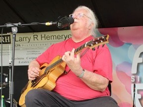 Thom Adkins of Sharp Dogs plays on the main stage Sunday, July 31, 2022, at the Simcoe Heritage Friendship Festival.  Back-to-back performances by various artists were scheduled on the stage from Friday to Monday.  MICHAEL RUBY
