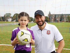 Mike Commito coached his daughter, Zoe, 6, along with other youngsters in the under 7 age group of the Sudburnia Soccer Club in Sudbury, Ont. this summer