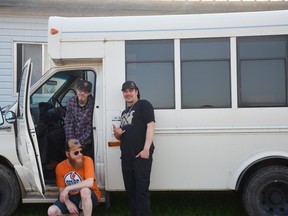 The Murms, including (clockwise from top left) guitarist and vocalist Billy Blair, bassist David Crowell and drummer Chris Bougie, boarded their new bus. The Whitecourt-based punk band is returning to the stage after a hiatus of more than a year.