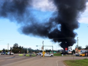 Smoke could be seen filling the skies of Whitecourt after a train collision north of town Friday morning. RCMP and bylaw officers manned the closure of Highway 43.