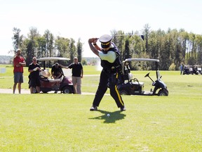 The Anthony Gordon Memorial Golf Classic has been a tradition in Whitecourt for 19 years; Cpl. Dean Purka is pictured here participating in full uniform 10 years ago. Const. Anthony Gordon was one of the fallen four in the 2005 Mayerthorpe tragedy. The tournament is going forward for Aug. 21 despite recent flooding at the golf course.