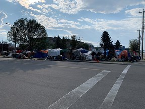 Sprawling encampment as seen from across a street.