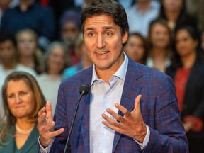 Primer Minister Justin Trudeau, flanked by Minister of Finance Christina Freeland and backed by the Liberal caucus meeting in London, made a series of announcements he claims will help the economy.