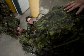 Forty-five soldiers from 41 Canadian Brigade Group load their gear into trucks as they head home from CFB Edmonton after helping fight wildfires in British Columbia during Operation LENTUS 23-08, Wednesday Sept. 13, 2023. Photo by David Bloom