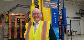 Andrew Stuart, president and CEO of Hydrogen Optimized, stands in front of the company's RuggedCell 100,000-ampere electrolyzer system, which breaks oxygen and hydrogen out of de-mineralized tap water on Thursday, Sept. 7, 2023 in Owen Sound, Ont. (Scott Dunn/The Sun Times/Postmedia Network)
