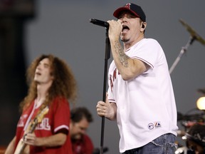 Singer Steve Harwell, of Smash Mouth, performs with the band during a rally celebrating the Los Angeles Angels' American League West Division Championship in Anaheim, Calif. on Monday, Sept. 29, 2008.